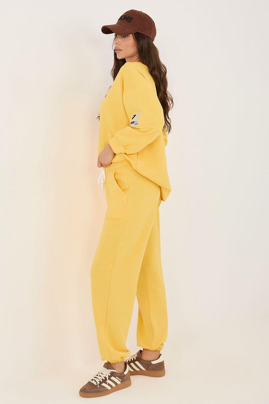 Rue Paris set model 226983 yellow sweatshirt and jogger pants, side view