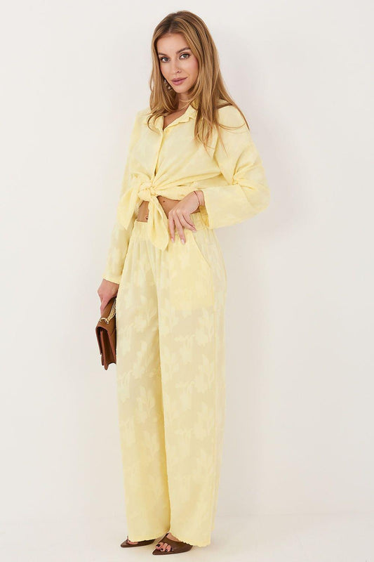 Yellow two-piece set with long-sleeve blouse and wide-leg trousers