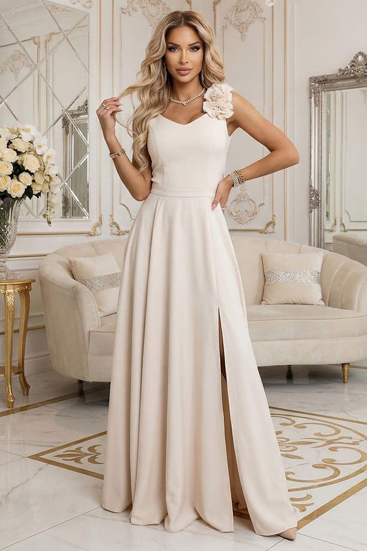 Beige evening dress with V-neck, sleeveless bodice, floral strap detail and long skirt
