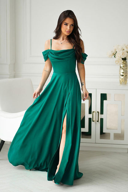 Long green off-shoulder maxi dress with draped sleeves and side slit.