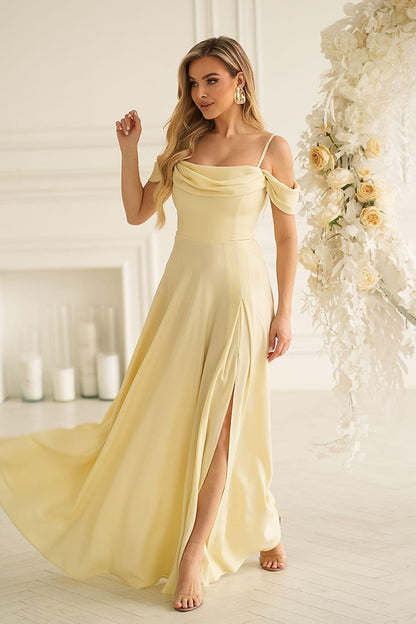 Long off-shoulder dress in light yellow with fitted bodice and flowing maxi skirt slit