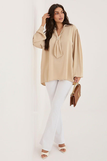 Beige blouse with neck tie, long gathered sleeves and V-neck opening