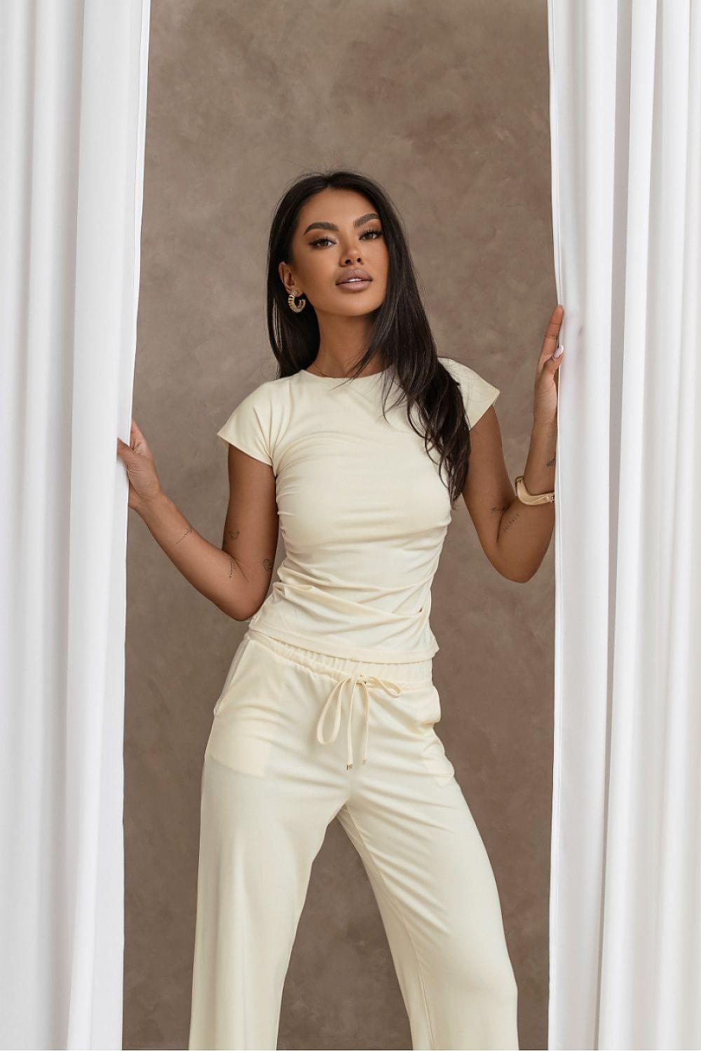 Cream two-piece set with short-sleeve crop top and drawstring wide-leg pants, full length