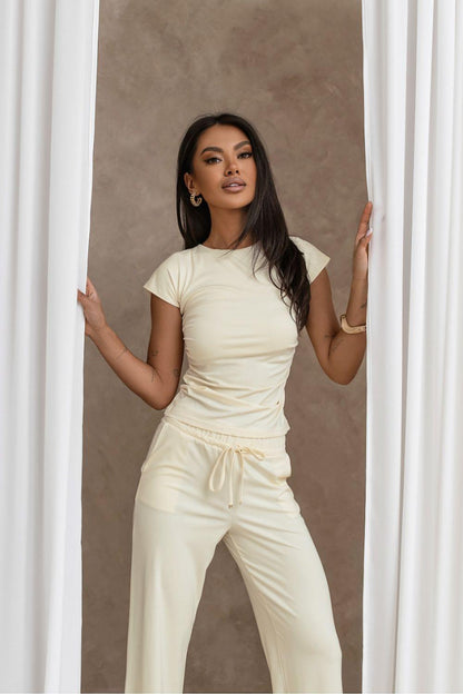 Cream two-piece set with short-sleeve crop top and drawstring wide-leg pants, full length