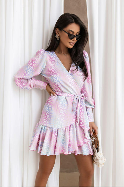 Pink patterned daydress with V-neck, long puff sleeves, belted waist, tiered skirt