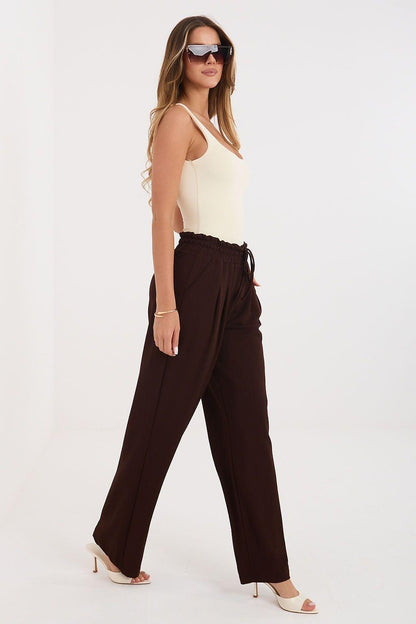 Tracksuit trousers in dark brown, elastic waistband with drawstring, loose wide-leg fit