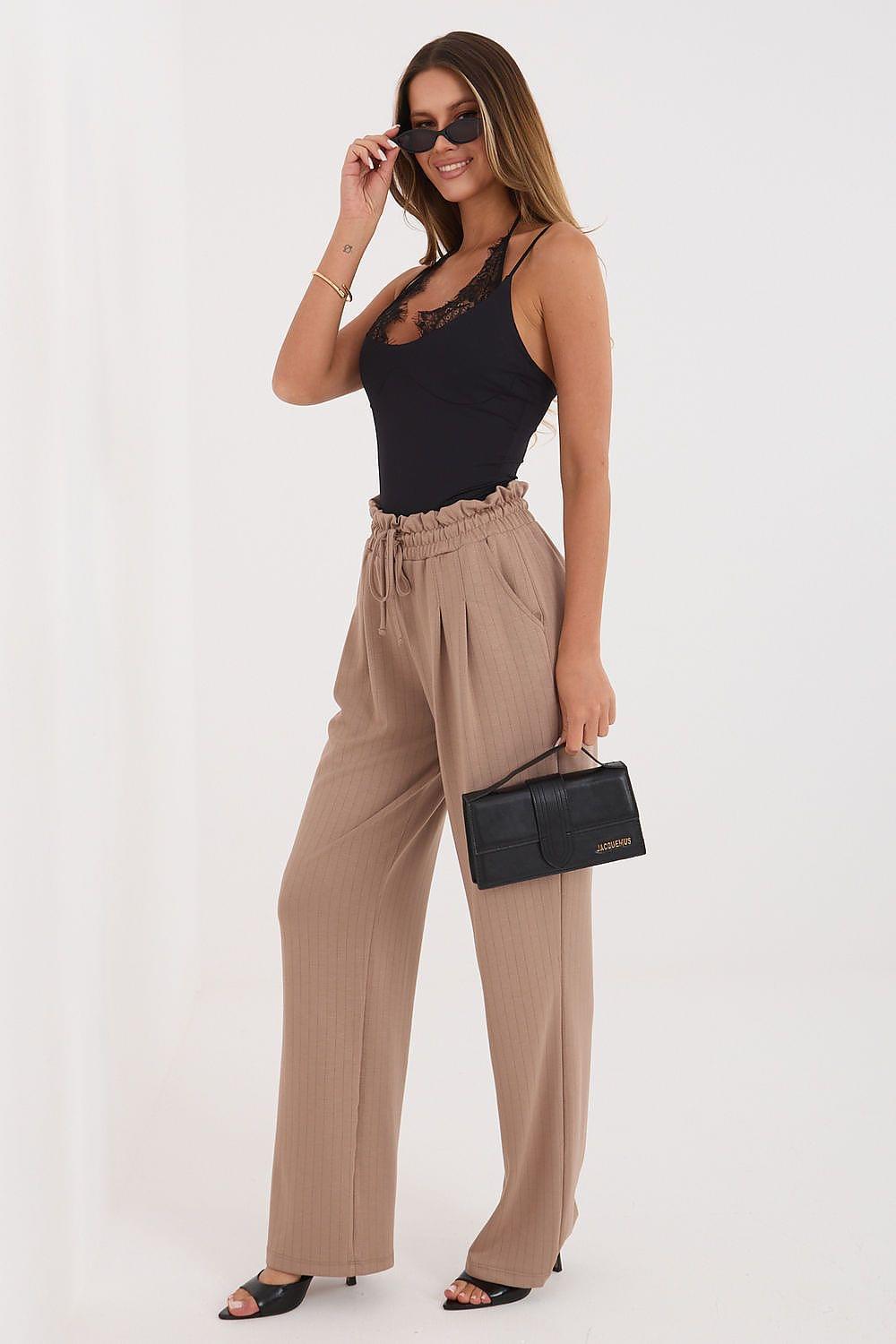 Tracksuit trousers in beige/tan, relaxed wide-leg cut with elastic drawstring waist