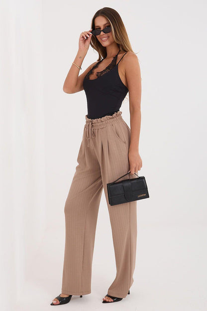 Tracksuit trousers in beige/tan, relaxed wide-leg cut with elastic drawstring waist