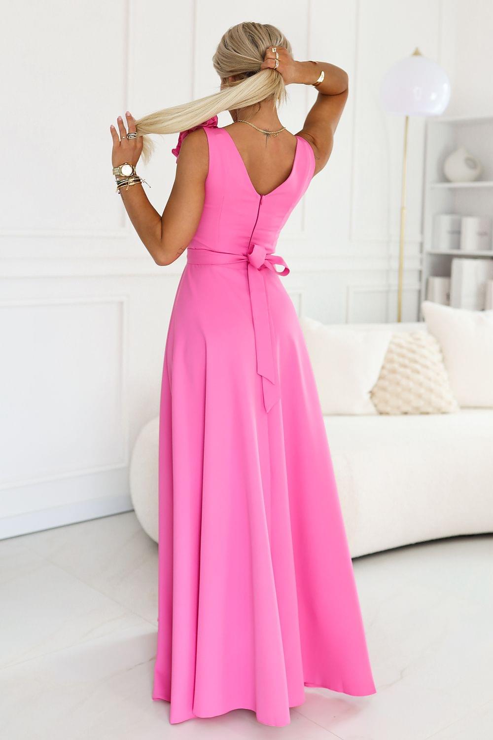 Pink evening dress from back view with open back and gathered waist