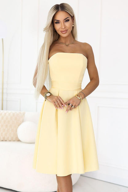 Evening dress with strapless sweetheart bodice and flared midi skirt, pale yellow