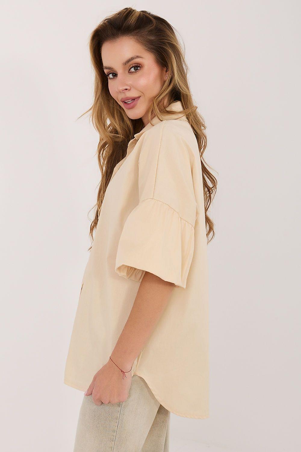 Cream button-front shirt with pointed collar and short puff sleeves, side view
