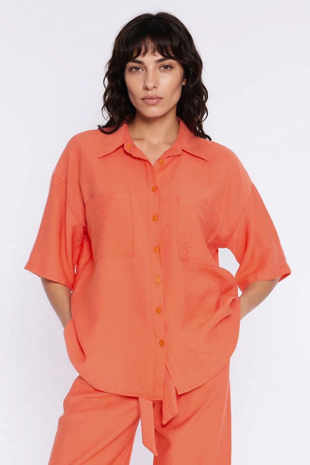 Orange short-sleeve button-up shirt with pointed collar and chest pockets