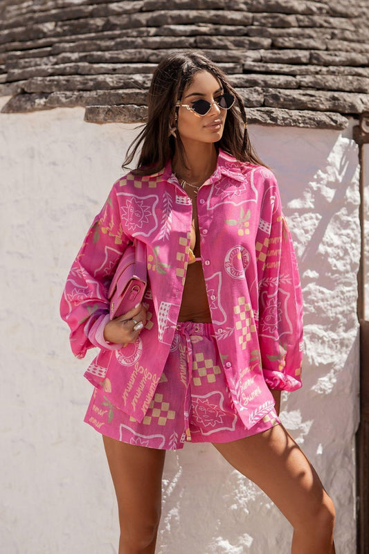 Fuchsia pink graphic mini dress with drawstring waist and long sleeves