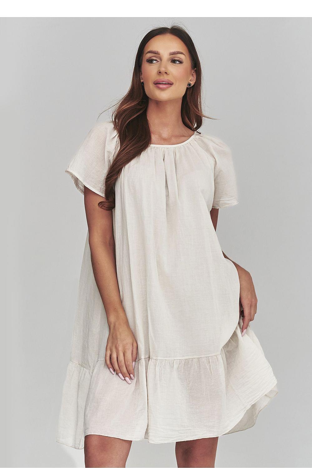 Beige daydress with short sleeves, gathered yoke, and layered skirt hem