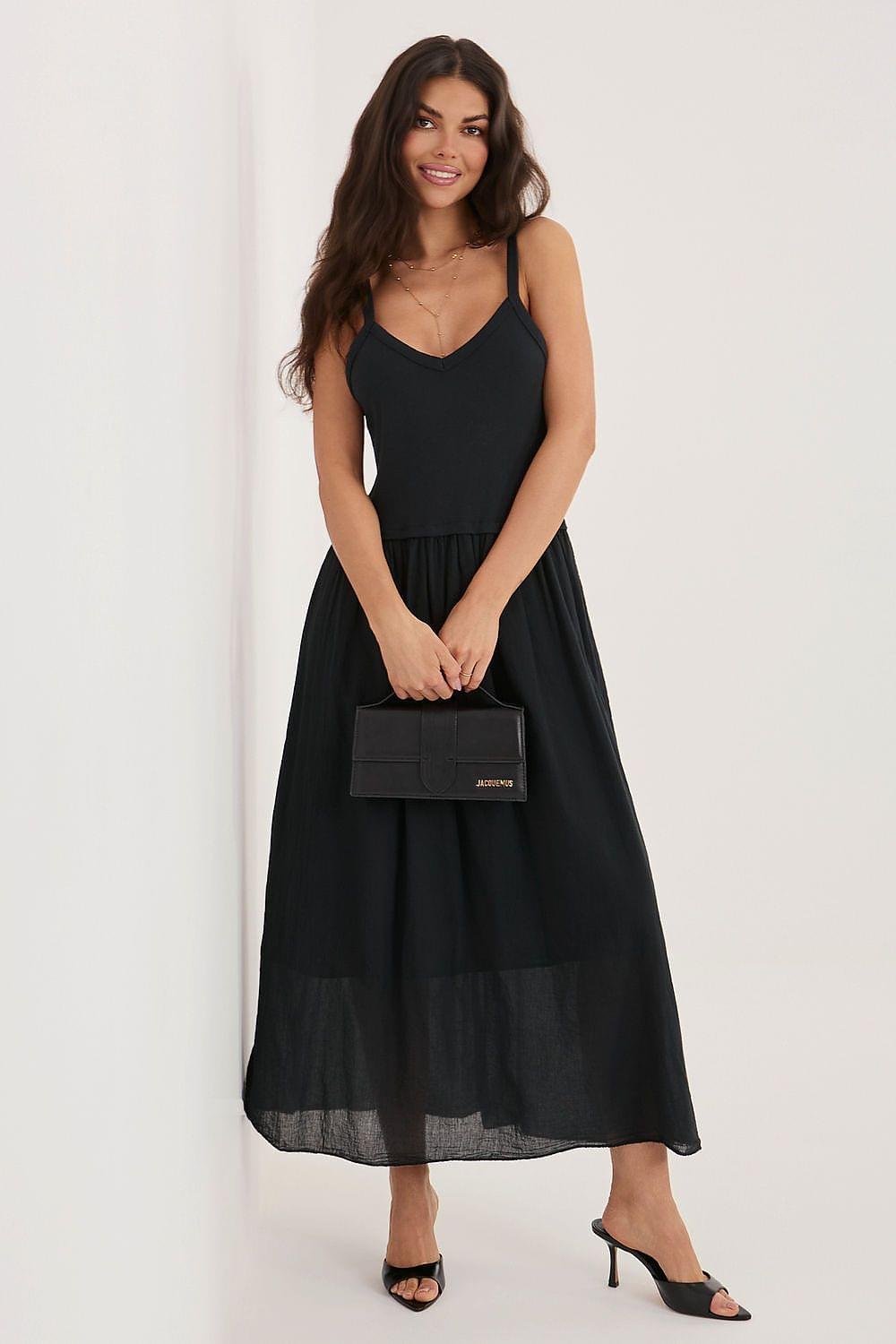 Black sleeveless day dress with V-neck, spaghetti straps and tiered sheer hem.