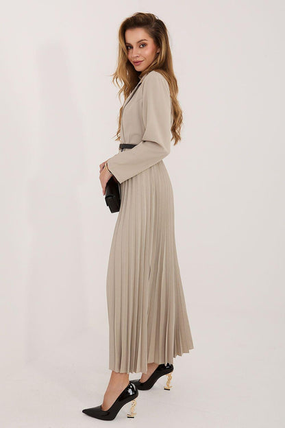 Beige pleated daydress with V-neck wrap bodice, long sleeves, and belt