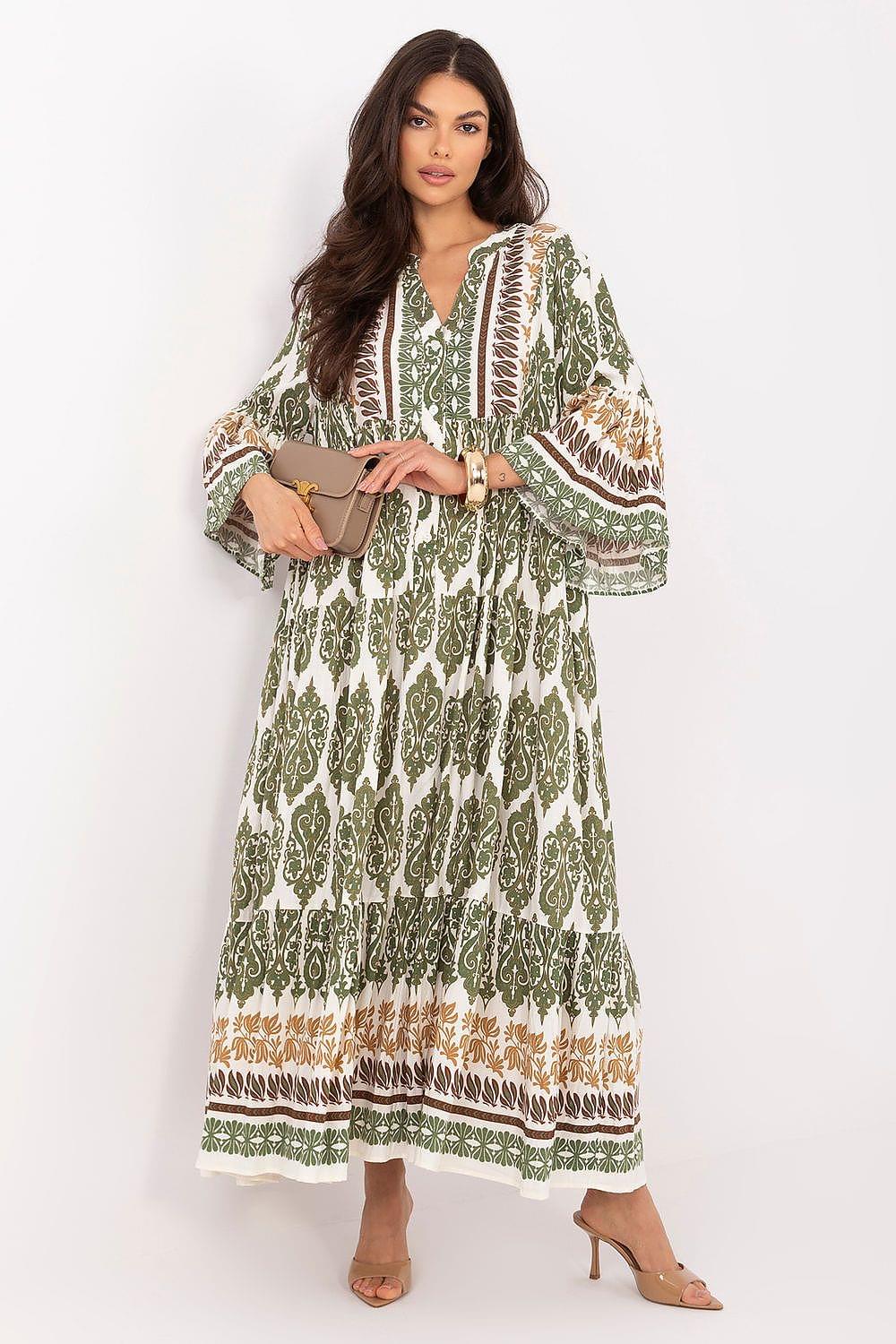 Green patterned daydress with V neckline, tiered hem, long flared sleeves