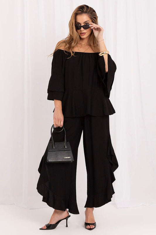 Black off-shoulder tiered blouse and wide-leg pants set with ruffled layers