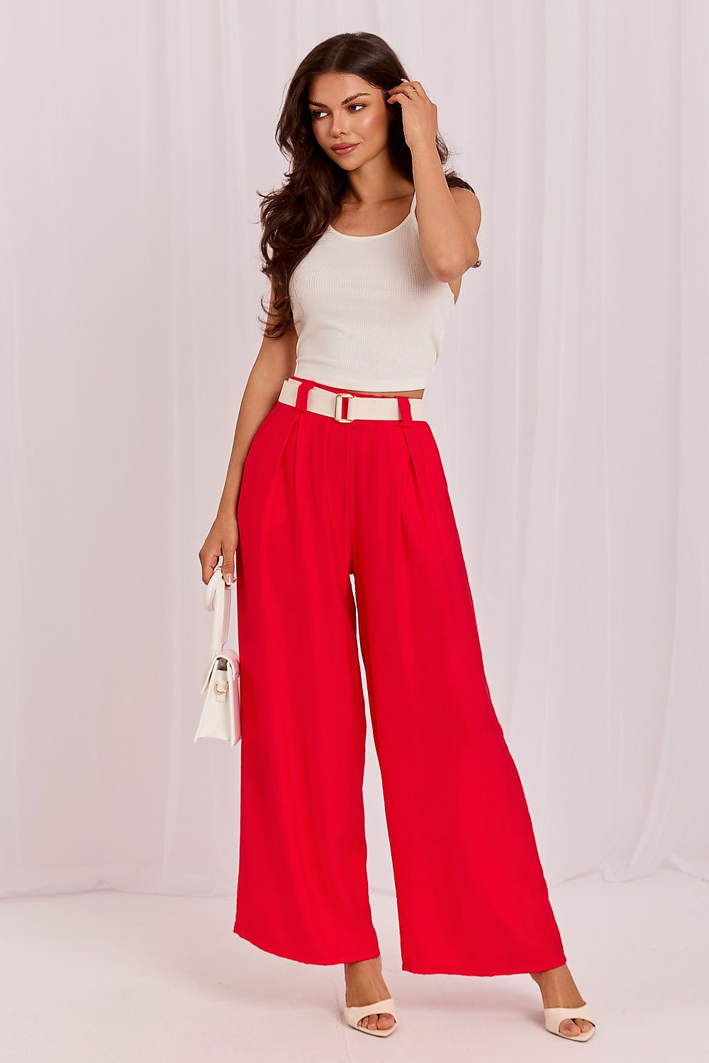 Women's red wide-leg trousers with high waist and belt buckle detail