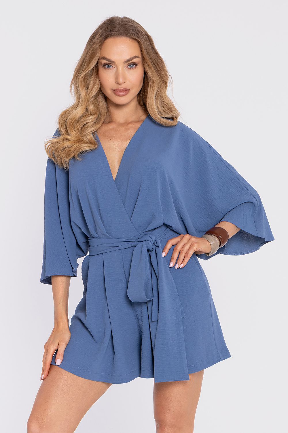 Blue wrap-style romper with V-neck, tie waist, and wide 3/4 sleeves