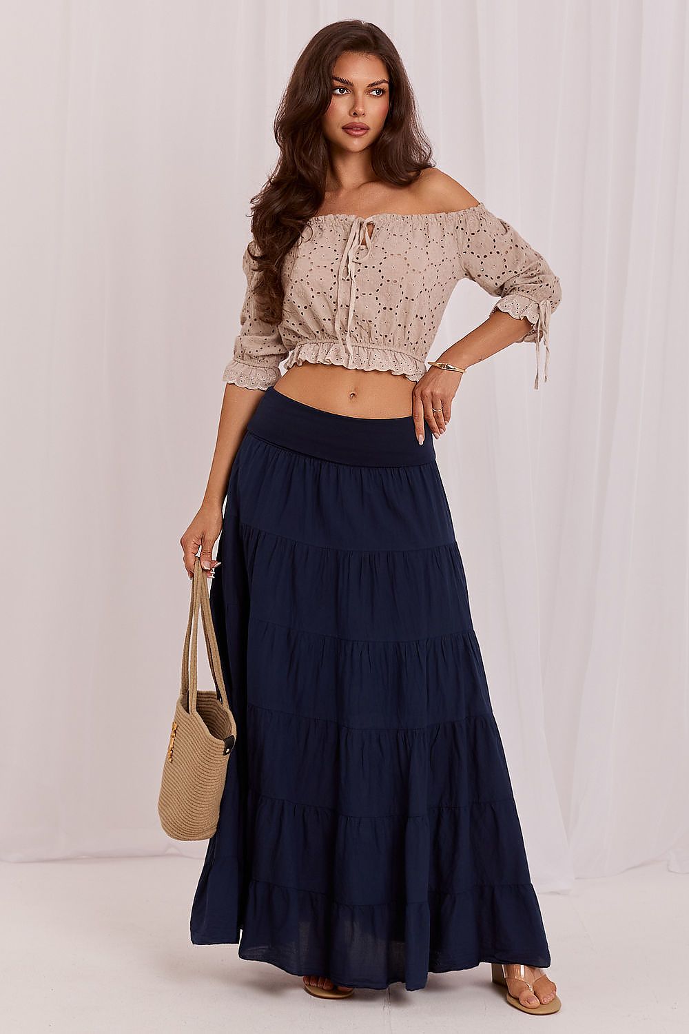 Navy blue tiered long skirt with elastic waistband and flowing maxi length