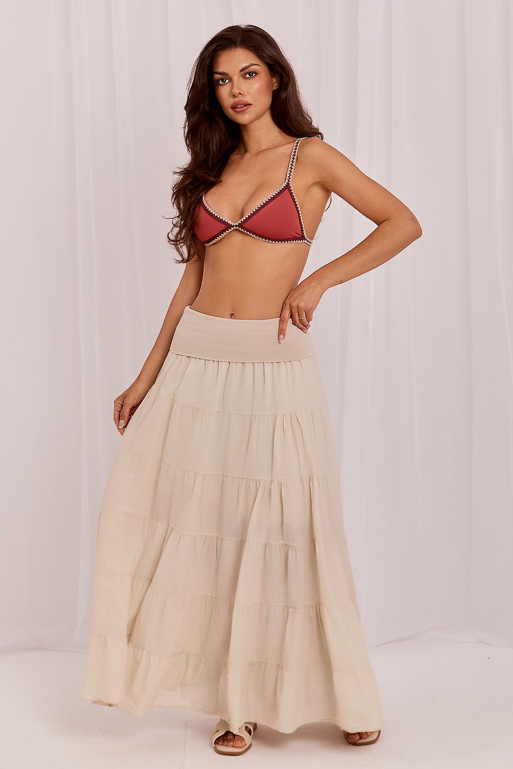 Beige long tiered skirt with elastic waist and layered ruffle tiers