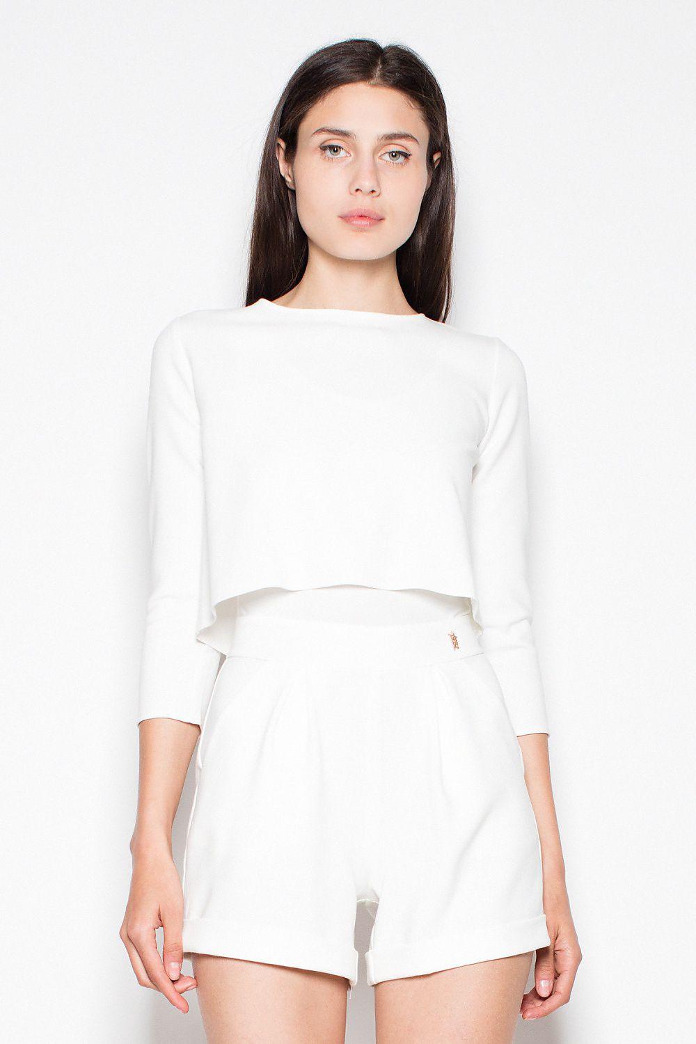 Two-piece suit: cropped long-sleeve top and high-rise shorts, light color