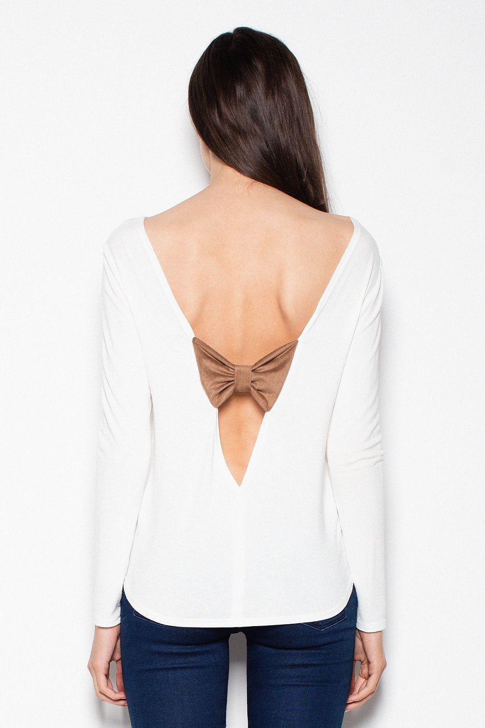 White long-sleeve blouse with deep open back and tan bow detail