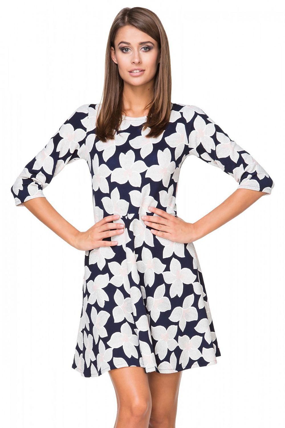 Navy blue daydress with white floral pattern, 3/4 sleeves and flared skirt