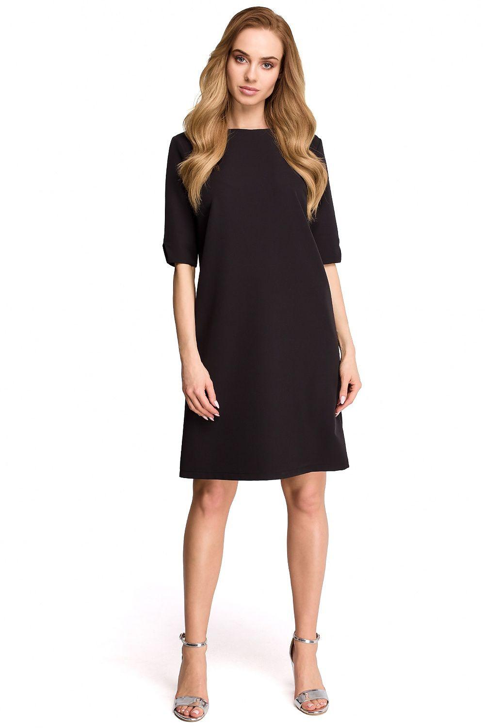 Black daydress with short sleeves and round neckline, straight knee-length cut.