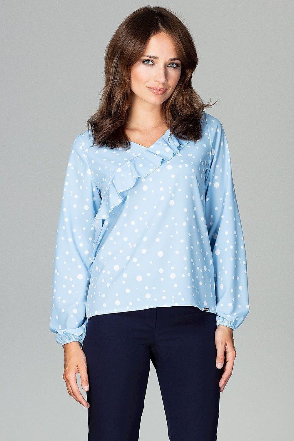 Light blue polka dot blouse with flounce front, long sleeves and V neckline