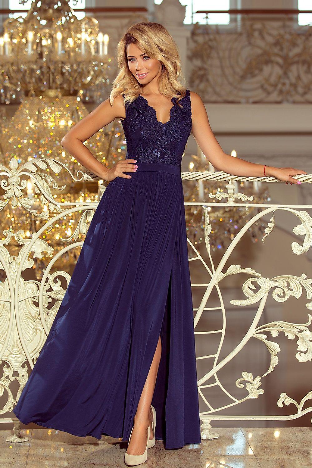 Navy maxi dress with embroidered neckline, sleeveless bodice, and side slit