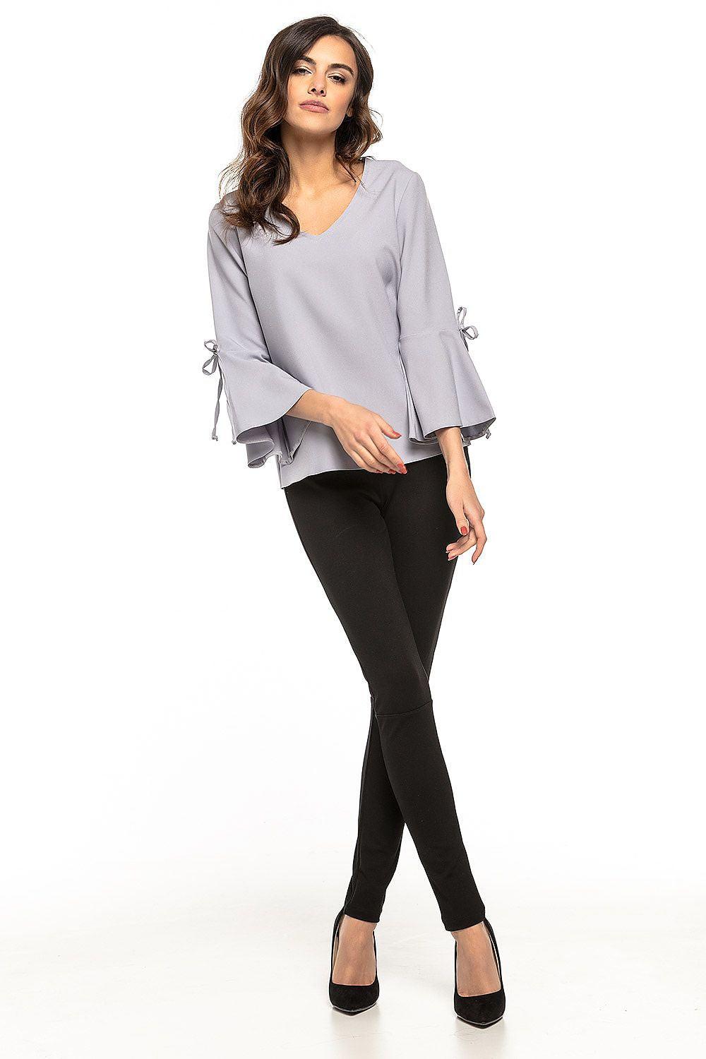 Grey V-neck blouse with flared sleeves and tie cuffs