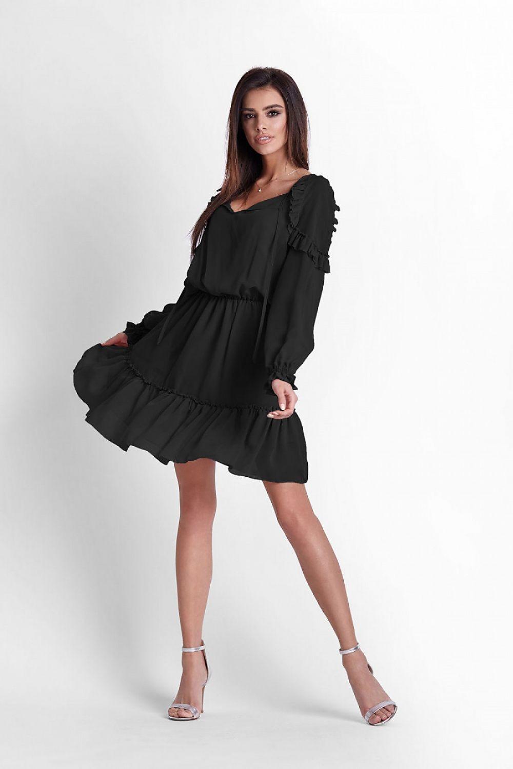Black cocktail dress with long puff sleeves, tie waist, and tiered skirt