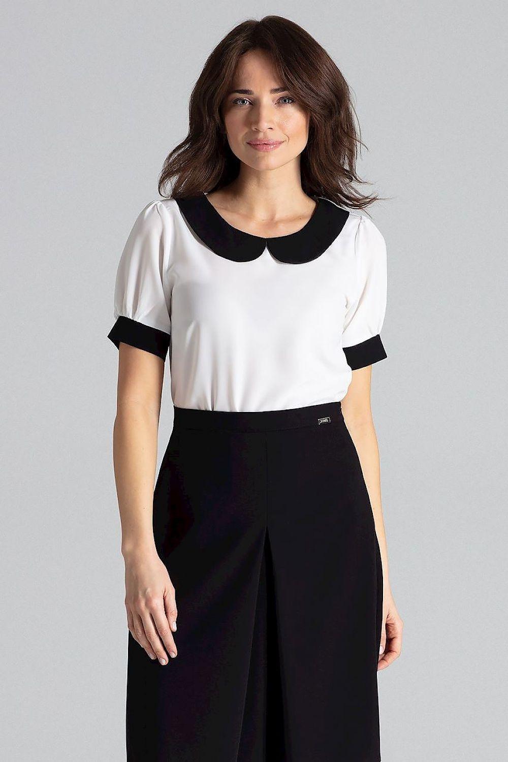 White blouse with black contrast collar and short-sleeve cuffs, fitted waist