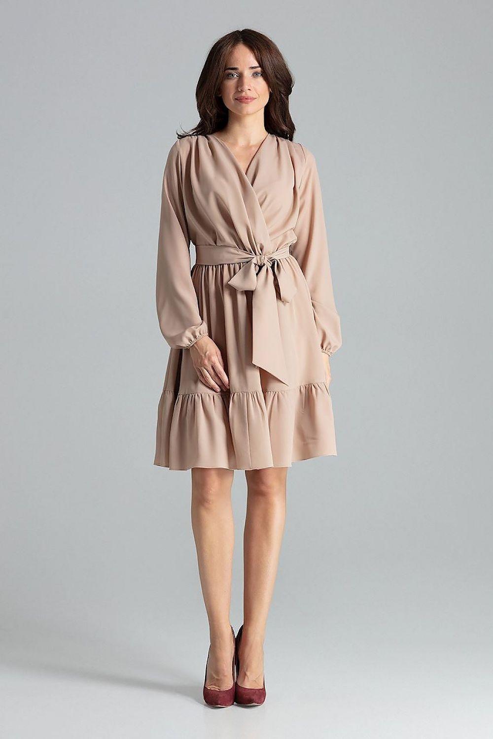Beige cocktail dress with V-neck, long sleeves, tie waist and tiered skirt.