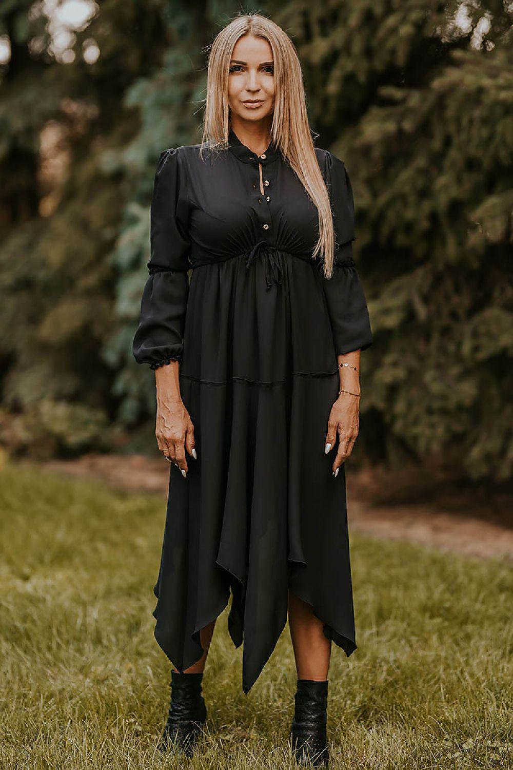 Black daydress with long sleeves, button front, and layered asymmetrical skirt