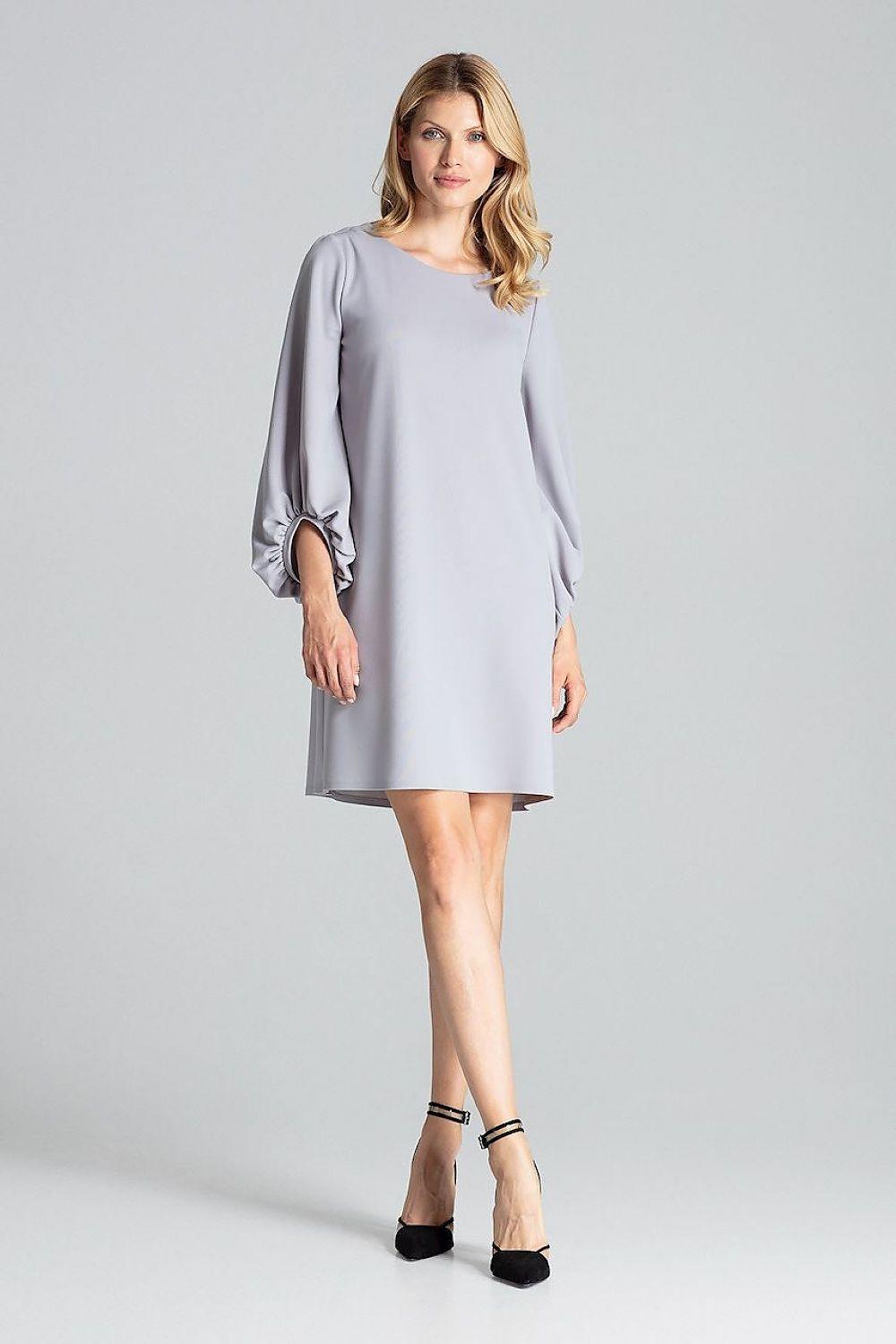 Grey daydress with wide elbow-length sleeves, round neckline, and straight above-knee hem.
