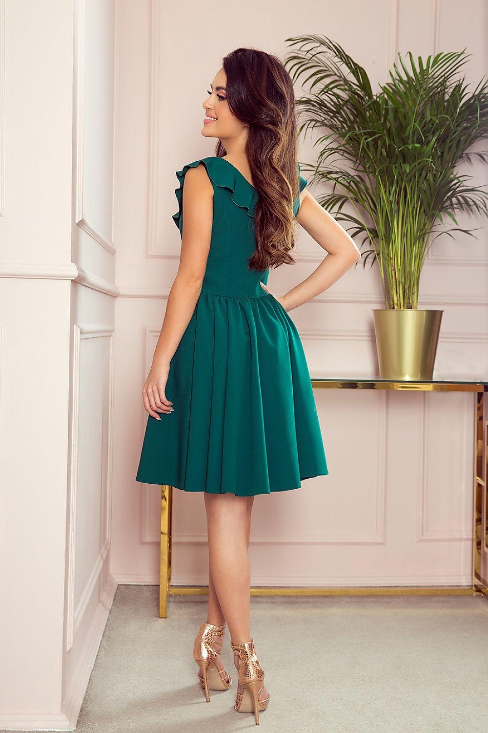 Numoco cocktail dress in green, sleeveless ruffle V-neck and pleated skirt, side view