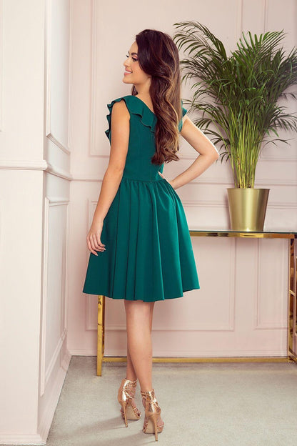 Numoco cocktail dress in green, sleeveless ruffle V-neck and pleated skirt, side view