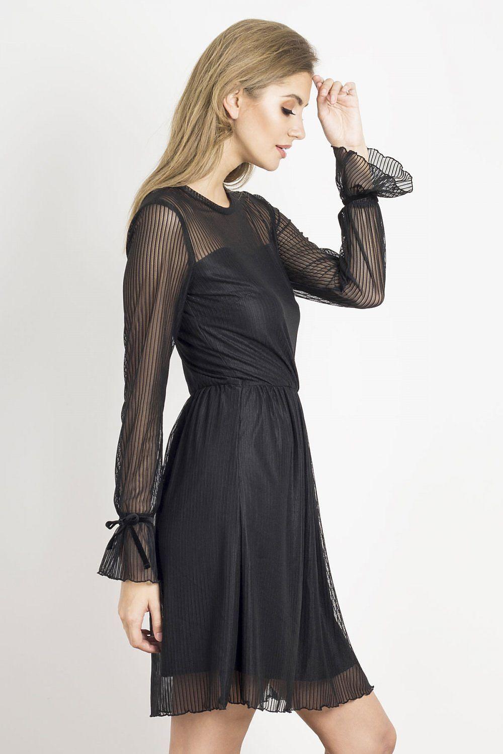 Black evening dress with sheer long sleeves, fitted waist, and pleated hem