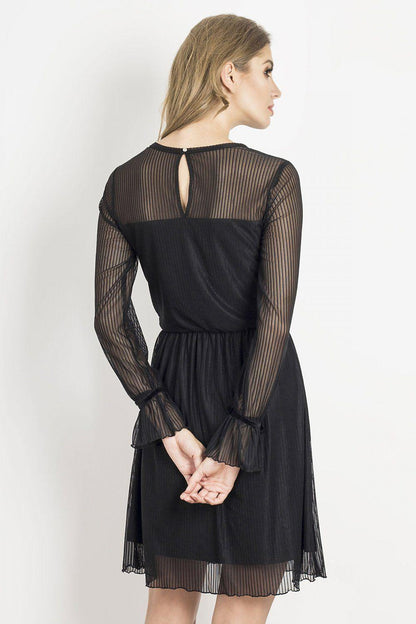 Black evening dress with sheer striped back panels and pleated mini skirt