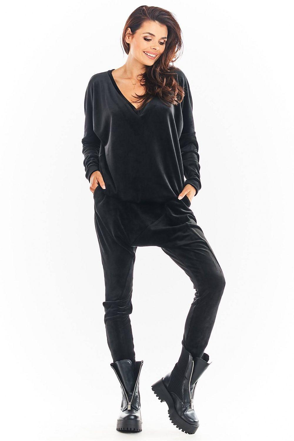 Black velour tracksuit trousers with elastic cuffs and tapered legs