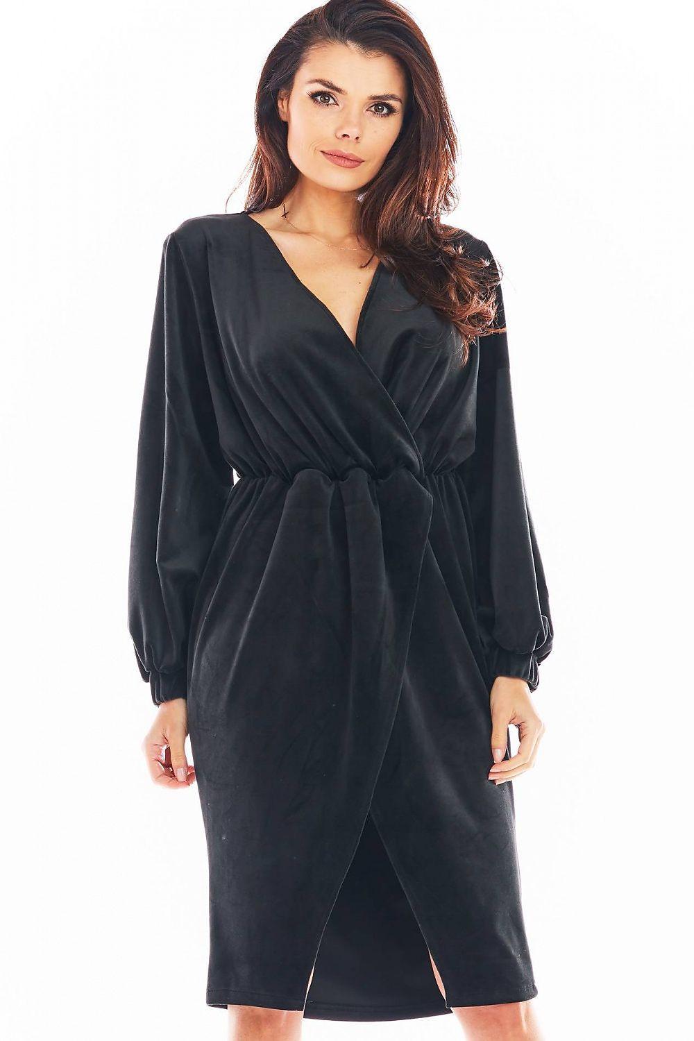 Black wrap-style velvet evening dress with long sleeves and belted waist