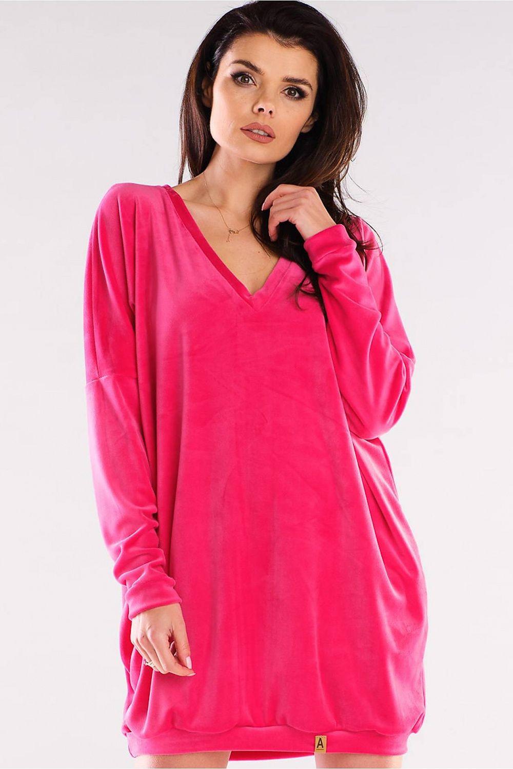 Pink daydress with long sleeves and V-neck, relaxed fit above-knee length.