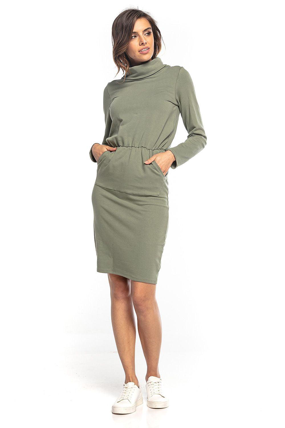 Olive green mock-neck daydress with long sleeves and gathered waist