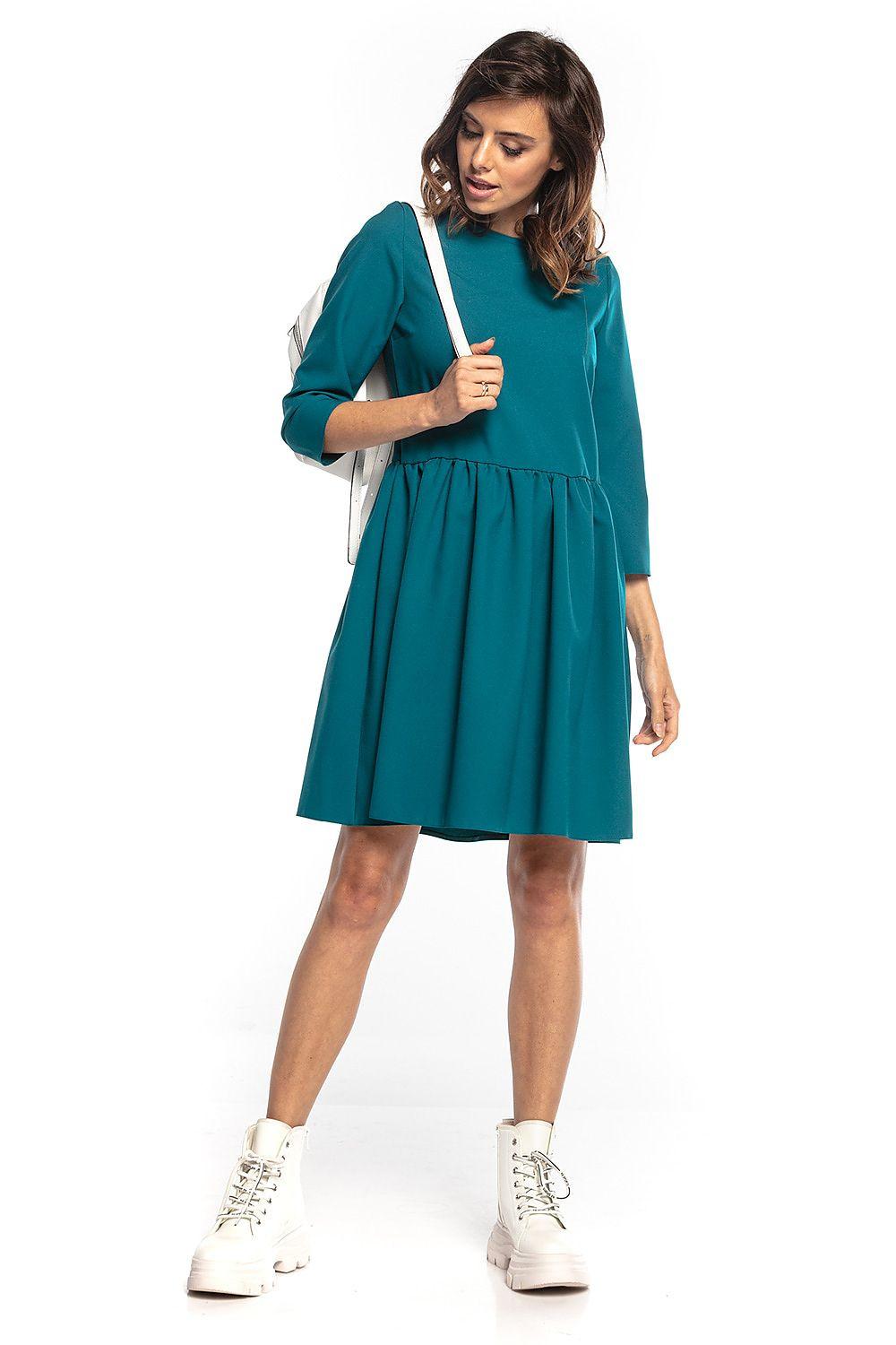 Teal Tessita daydress with 3/4 sleeves, gathered waist, and front keyhole detail