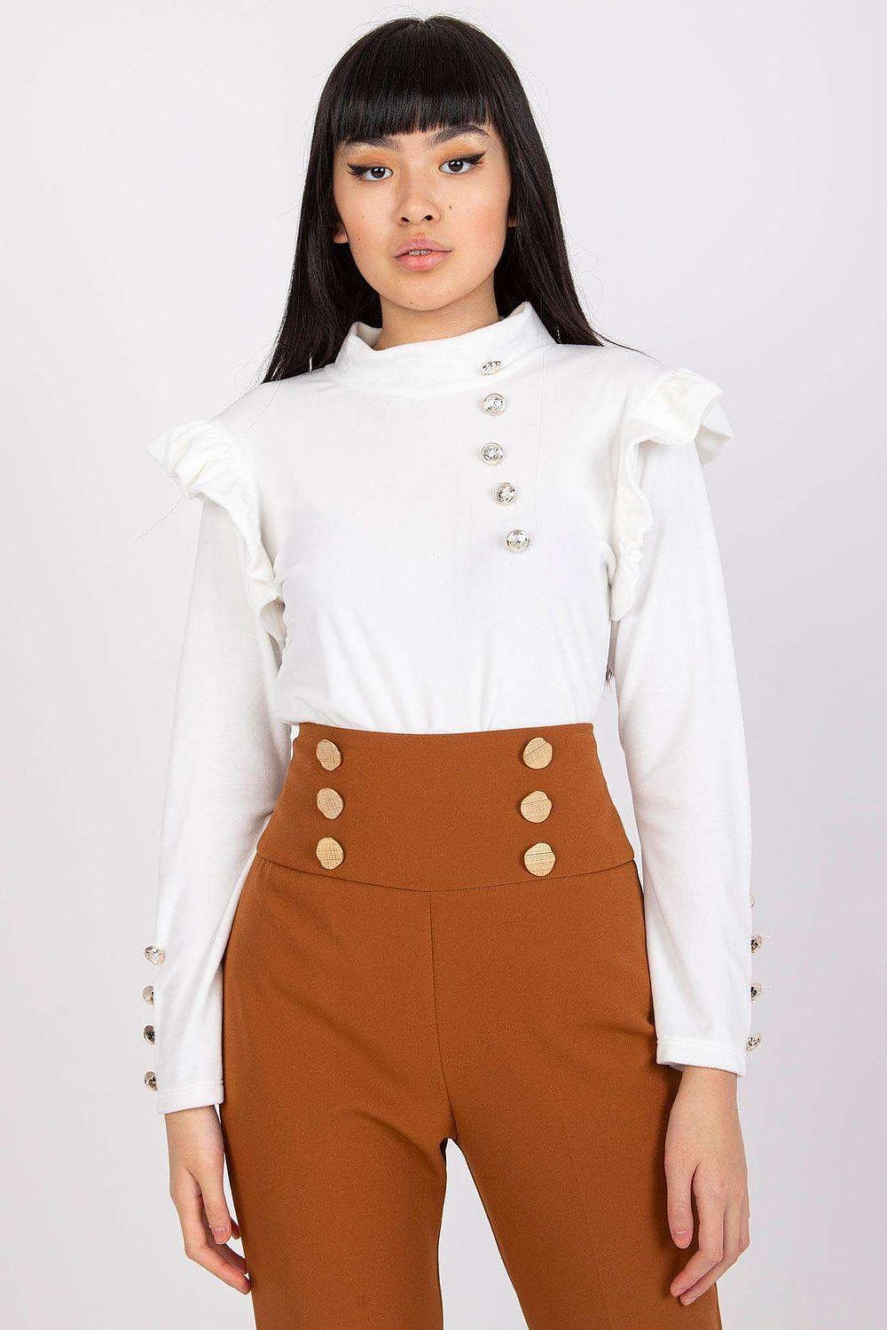White blouse with ruffled shoulder details, button-front, and long sleeves