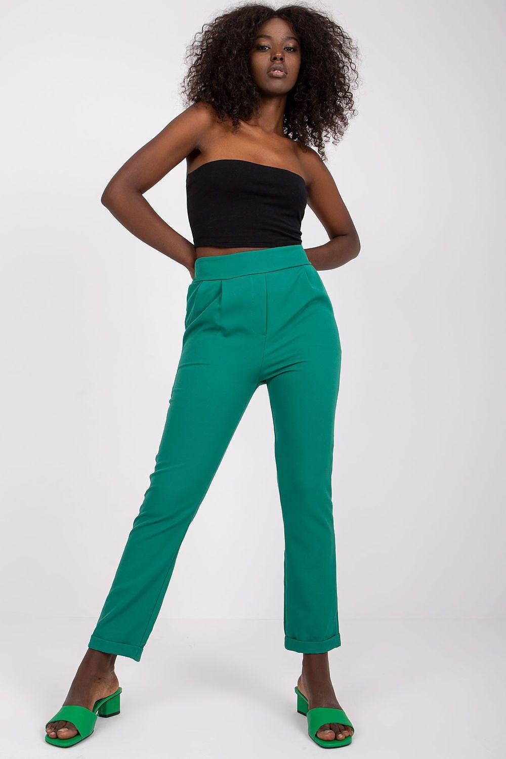 Green ankle-length trousers with straight legs, belt loops, and zip fly