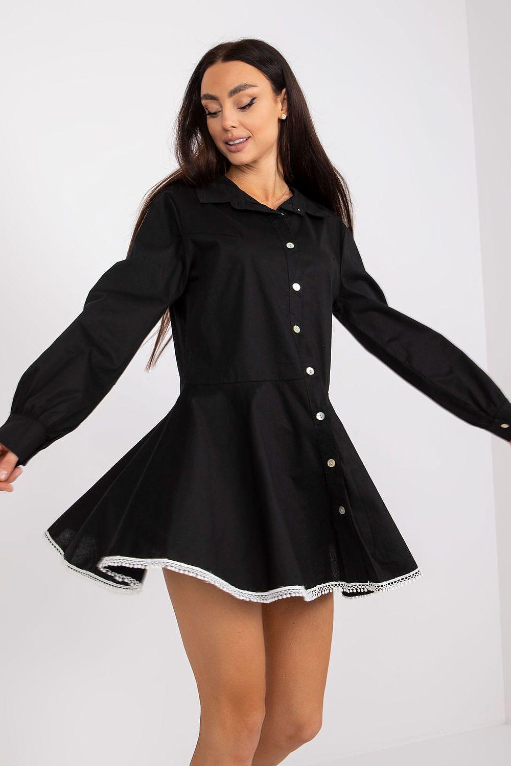 Black long-sleeve button-front daydress with collar and white trim hem